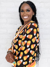 Load image into Gallery viewer, Queen Of Sparkles Black Pearl Candy Corn Cardigan with beaded orange, white and yellow candy corn and striped details on collar and sleeves