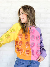 Load image into Gallery viewer, Queen of Sparkles Colorblock Multi Skull Sweatshirt with color blocking stripes of yellow, orange, pink and light purple with sequin beaded skulls