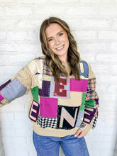 Load image into Gallery viewer, Queen Of Sparkles Beige Multi Queen Patchwork Sweatshirt with black and white checkered patches, camel plaid and multi color block letters