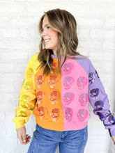 Load image into Gallery viewer, Queen of Sparkles Colorblock Multi Skull Sweatshirt with color blocking stripes of yellow, orange, pink and light purple with sequin beaded skulls