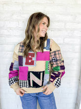 Load image into Gallery viewer, Queen Of Sparkles Beige Multi Queen Patchwork Sweatshirt with black and white checkered patches, camel plaid and multi color block letters