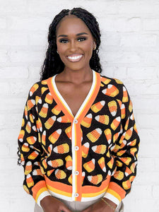 Queen Of Sparkles Black Pearl Candy Corn Cardigan with beaded orange, white and yellow candy corn and striped details on collar and sleeves