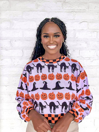 Queen Of Sparkles Checker Trim Icon Sweater with sequin black cats, pumpkins and witches hat
