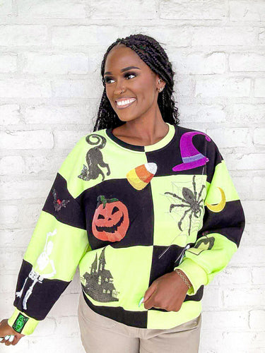 Queen Of Sparkles Green And Black Checkered Icon Sweatshirt with purple sequin witches hat, orange pumpkin, sequin spiderweb and candy corn