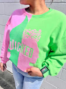 Queen of Sparkles Wicked pink and green color-block sequin sweatshirt