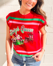 Load image into Gallery viewer, Model wearing Queen of Sparkles “Sleigh Queen” red stripe top with sequin Santa sleigh and reindeer