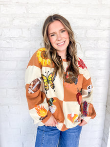 Queen Of Sparkles Checkered Fall Icon Sweatshirt with sequin icons of fall colors, pumpkin pie, butterfly and footballs