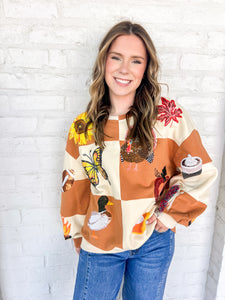 Queen Of Sparkles Checkered Fall Icon Sweatshirt with sequin icons of fall colors, pumpkin pie, butterfly and footballs
