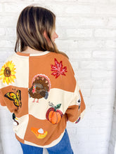 Load image into Gallery viewer, Queen Of Sparkles Checkered Fall Icon Sweatshirt with sequin icons of fall colors, pumpkin pie, butterfly and footballs