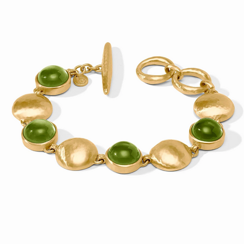 Gold bracelet with green beads on a white background